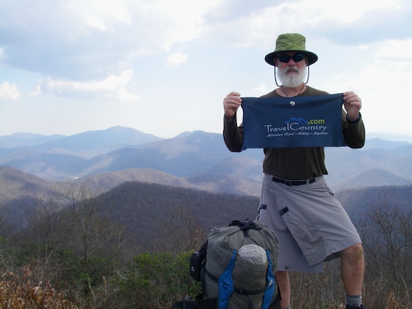 Krispy Kritter with a Travelcountry Sign